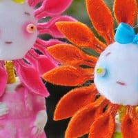 בובות ילדים עם פנים של פרחים