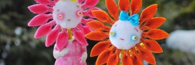בובות ילדים עם פנים של פרחים